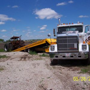 Transporting Tractor with Landoll Trailer