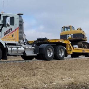 Transporting Excavator with Landoll Trailer