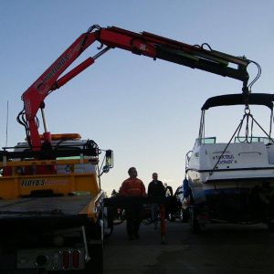 Transporting Boat with Knuckle Boom Crane